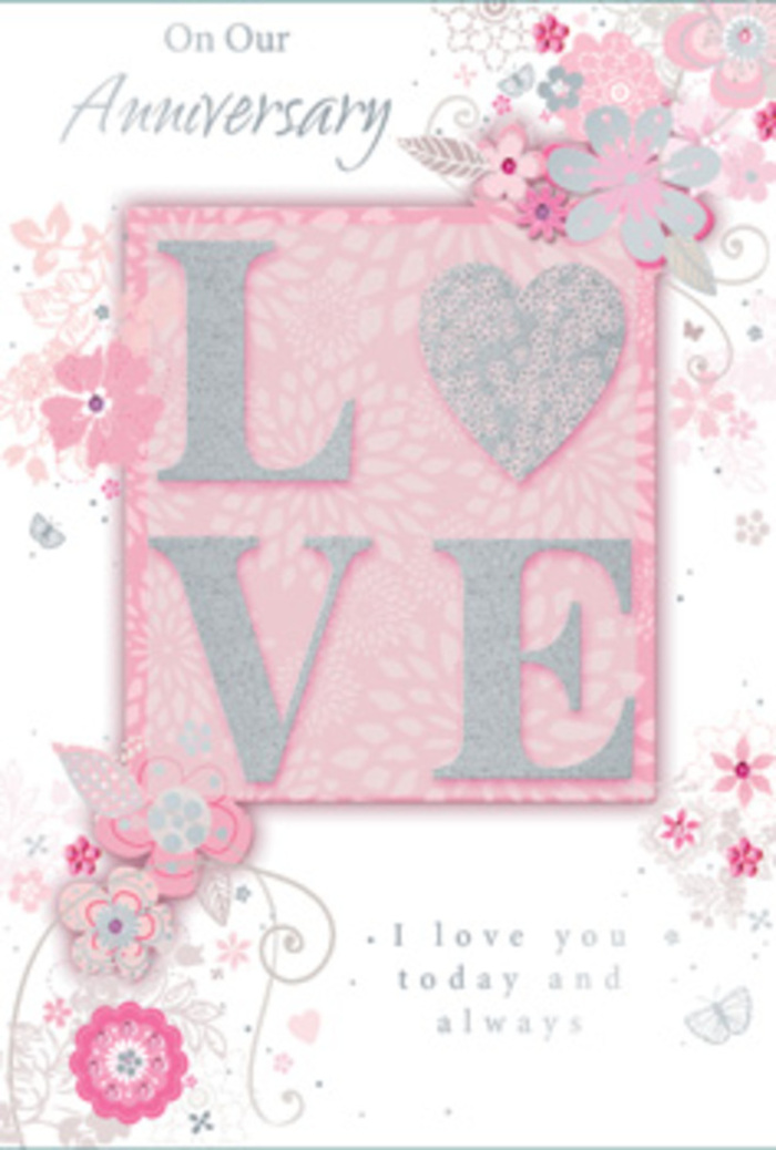 An anniversary card is displayed in soft lighting, its romantic details unfolding like a bouquet crafted for a special evening in Swiss Cottage. The background is a tender shade of powdery pink, even and velvety, which creates a soothing field of colour across the card's surface. At the centre, the word LOVE stands proud in raised lettering, each letter slightly rounded and finished with a lustrous border of fine glitter. The glitter adds a pale, silvery sheen that softly glows rather than sparkles harshly, as if the letters are catching the last light before dusk settles over the nearby gardens and terraces. The tactile quality of the raised word invites an almost instinctive urge to touch, enhancing the intimacy of the card. Encircling this central message, an intricate design of stylised flowers and leaves spreads in airy, looping lines. The blossoms appear in simple, elegant forms-some open, some budding-drawn in slender strokes of white and pale grey, with carefully placed silver accents. These lines curl and weave like flowing stems in a florist's design, not unlike the hand-drawn plans used for anniversary bouquets heading out from Swiss Cottage Florist to addresses along Finchley Road or towards West Hampstead. Subtle shading within the petals creates depth, while delicate vines extend and curl, framing the word LOVE with a sense of movement and grace. Inside, a glimpse of beautifully lettered script delivers heartfelt, enduring sentiments, conveying gratitude and commitment. The card's entire composition-the serene colour palette, shimmering detail, and swirling florals-evokes the feeling of a quiet, meaningful celebration, the kind of moment shared over dinner at home, fresh flowers on the table, and the city humming softly beyond the windows.